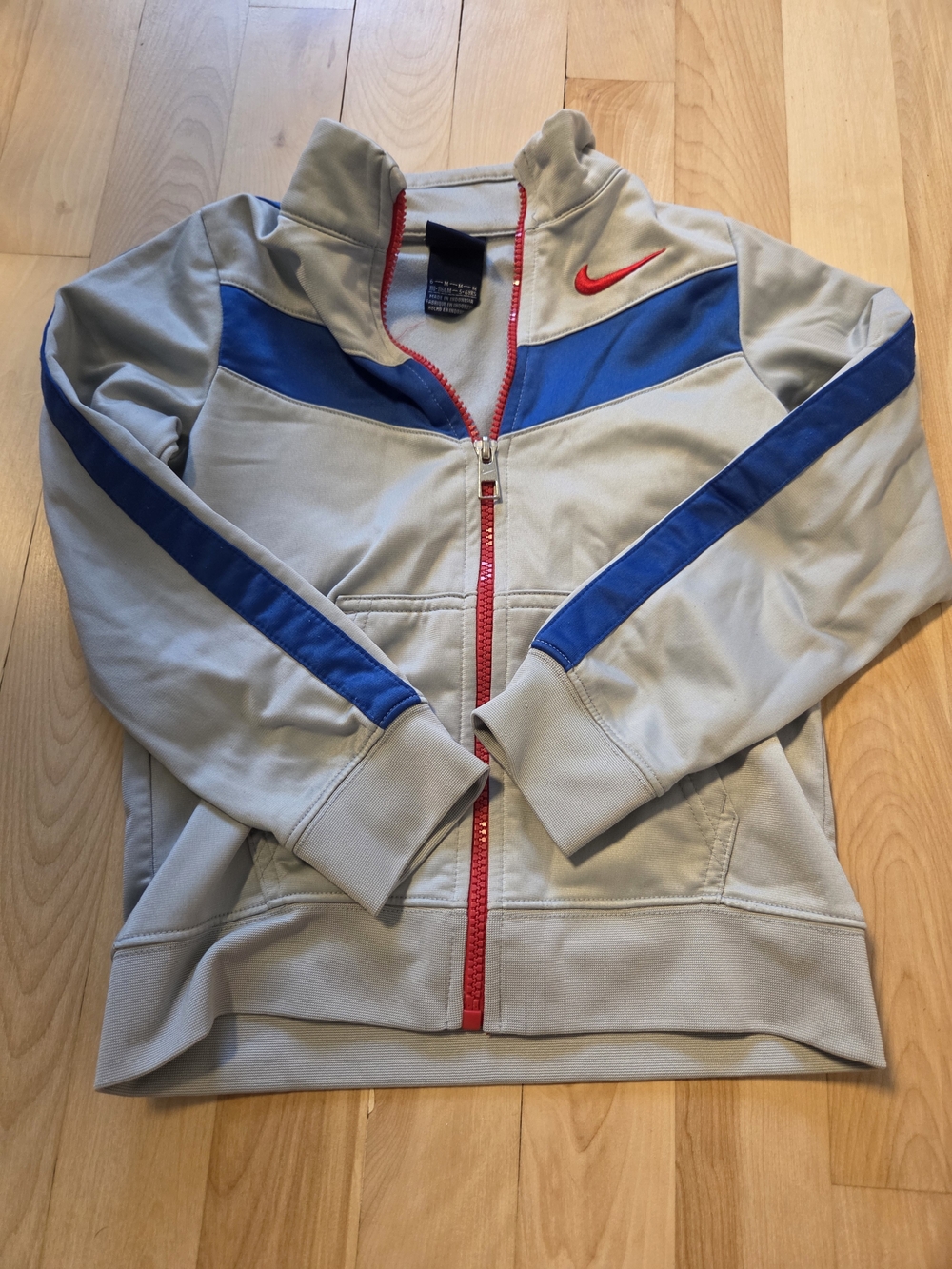 Nike Kids Light Gray Jacket with Blue Panels and Red Trim
